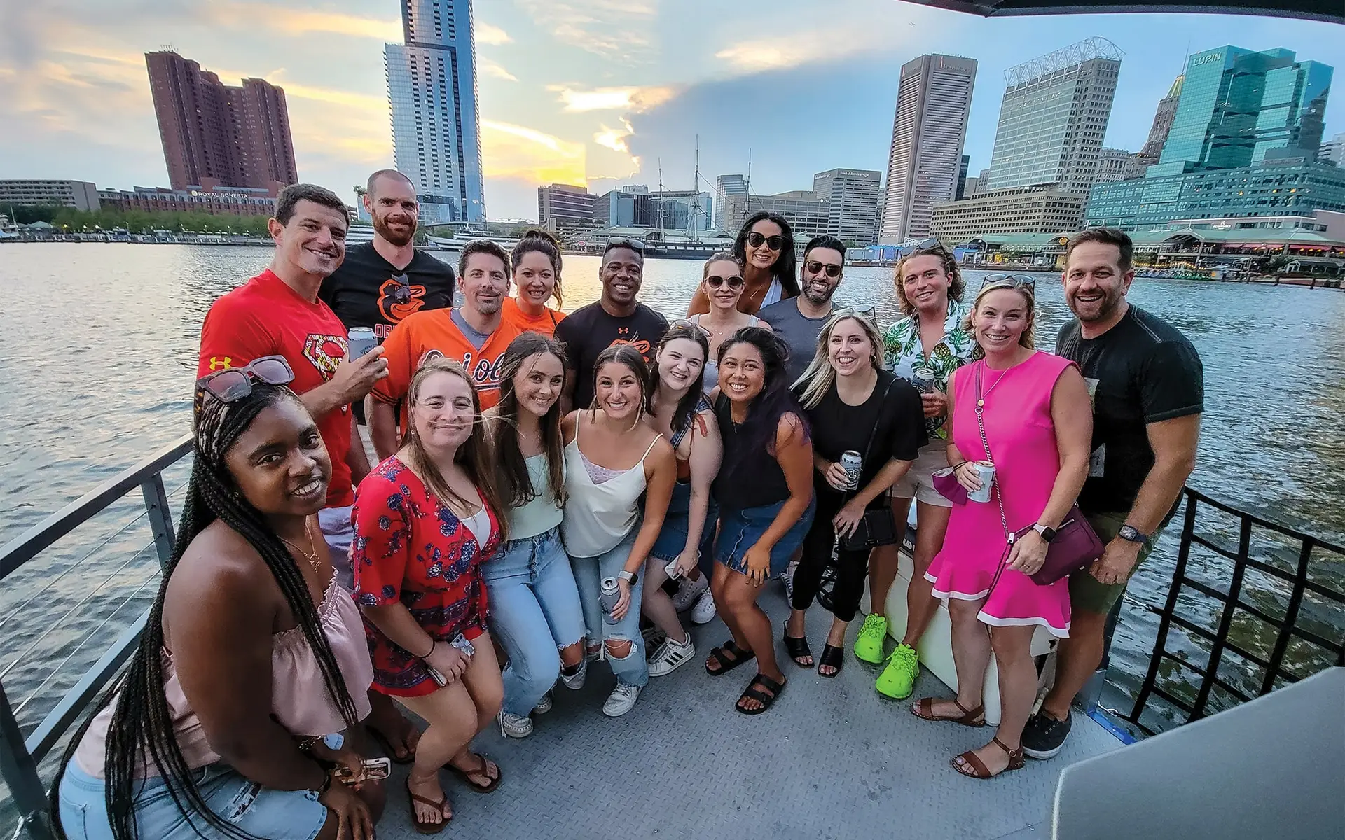 Paddle boat booze cruise group photo at the Inner Harbor in Baltimore, MD. Baltimore Paddle Club by Sea Suite Cruises.