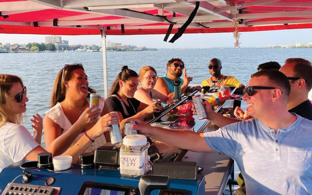 The Wharf paddle boat booze cruise near Washington DC. BYOB! People drinking on the water. Potomac Paddle Club by Sea Suite Cruises.