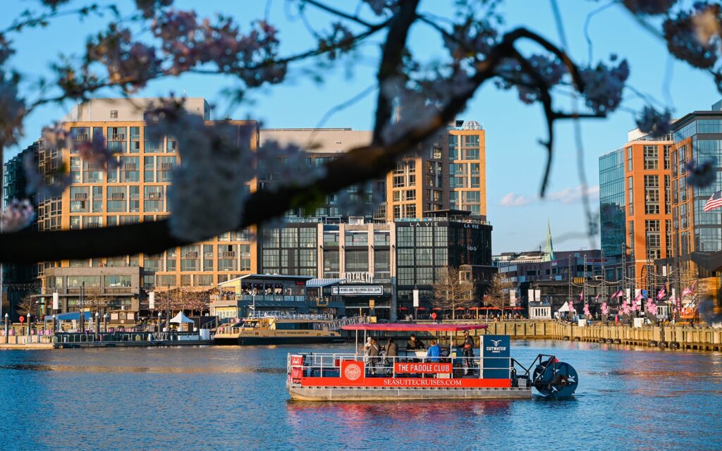 Washington DC Paddle Boat booze cruise in front of the city. Potomac Paddle Club by Sea Suite Cruises.