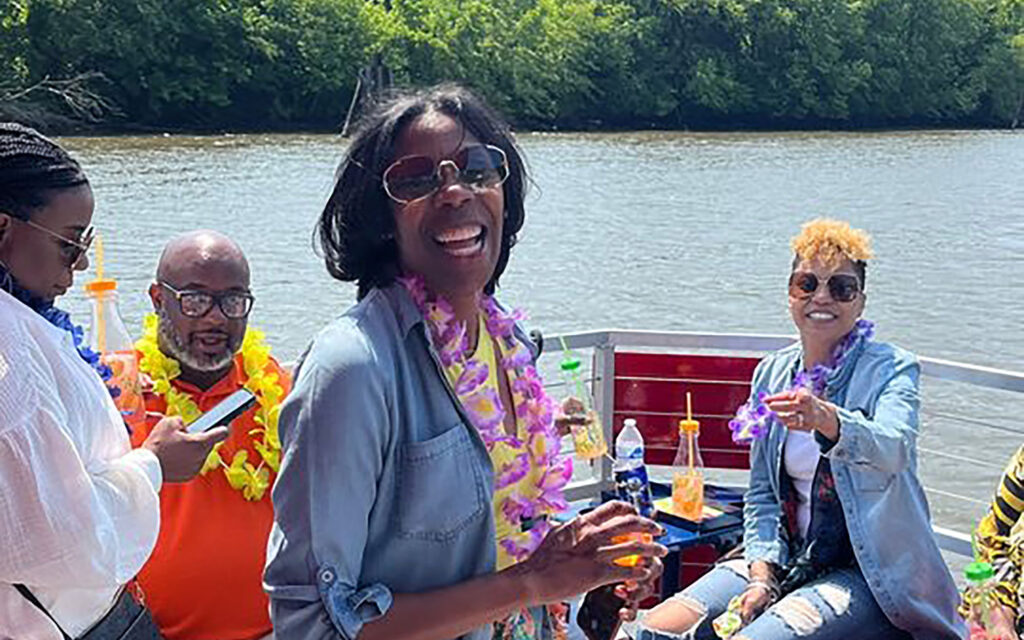 Family and friends enjoying a birthday cruise near Rocketts Landing in Richmond.