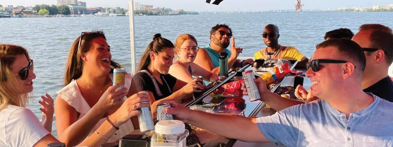 The Wharf paddle boat booze cruise near Washington DC. BYOB! People drinking on the water. Potomac Paddle Club by Sea Suite Cruises.
