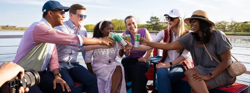People drinking beer on a Washington DC paddle boat cruise at the Wharf. Potomac Paddle Club by Sea Suite Cruises.